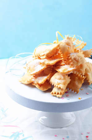 Italian carnival fritters dusted with powdered sugar. Selective focus. With free text space.の写真素材