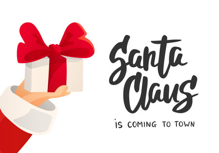 Christmas card. Santa Claus is coming text. Cartoon flat illustration. Hand holding present with bowのイラスト素材