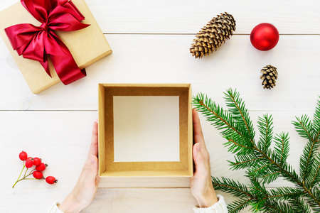 Empty box for a present for Christmas and New Year in the hands of a man.の写真素材