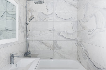 Bathroom interior after repairs. Bathroom in light gray colors.