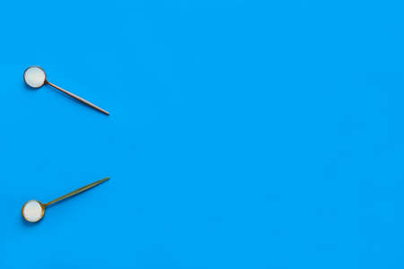Marine collagen powder in spoons on a blue background. Dietary supplement. Horizontal orientation, top view, copy space.の写真素材