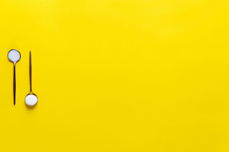 Marine collagen powder in spoons on a yellow background. Dietary supplement. Horizontal orientation,...