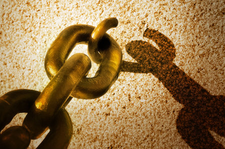 Finding the joint in the armour chainの写真素材