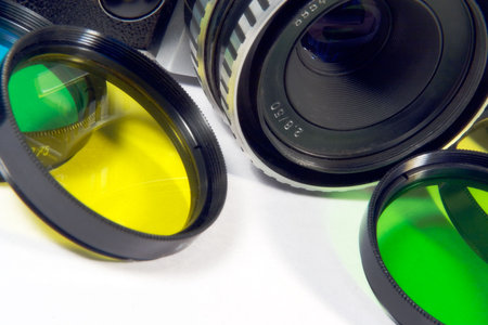 Old mechanical SLR with a set of color creative and conversion filtersの写真素材
