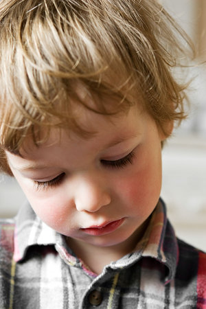 Portrait of the small sad boyの写真素材