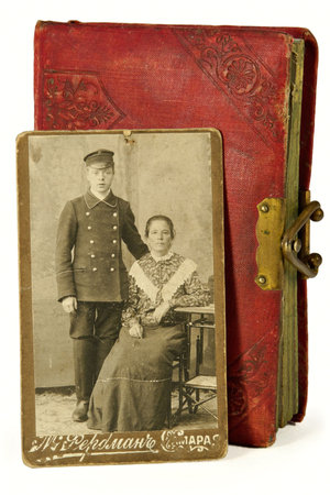Lady and gentlemen in an ancient photo of the beginning of 20 centuries