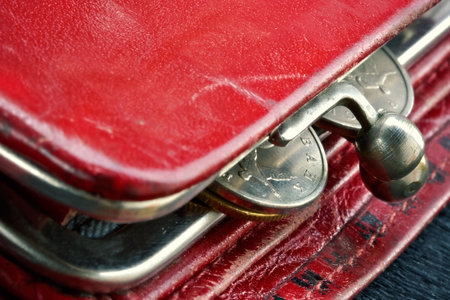 Shabby purse with last coinsの写真素材