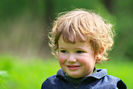 Child with curiosity and mistrust observes of a flying mosquitoの写真素材