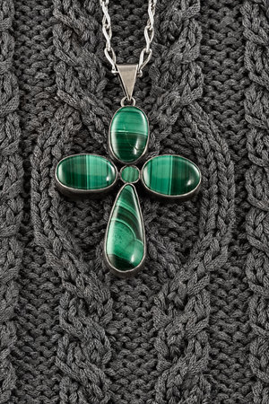 Stylized under fourleafed clover female gem on a background of traditional Irish ornamentの写真素材