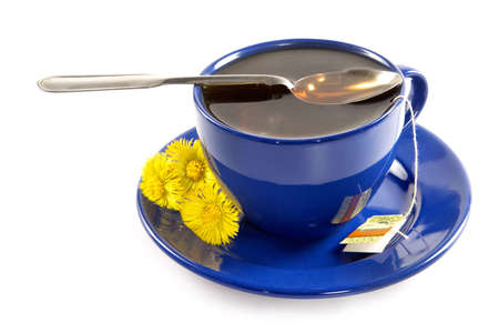 Strong spring fragrant tea in a dark blue cupの写真素材