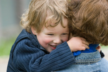 child and mother-happy together walk in park in  summerの写真素材