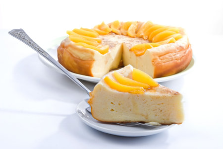 big celebratory vanilla pudding pie with peach segmentsの写真素材