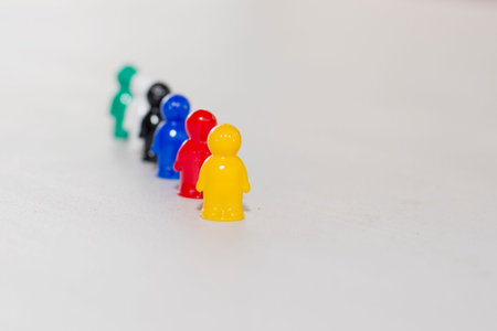 Concept of leadership. Yellow shirt of a winner. Focus on a front item.