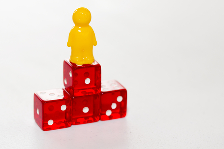 Concept of victory. Yellow figure stands on the pedistal. First place.の写真素材