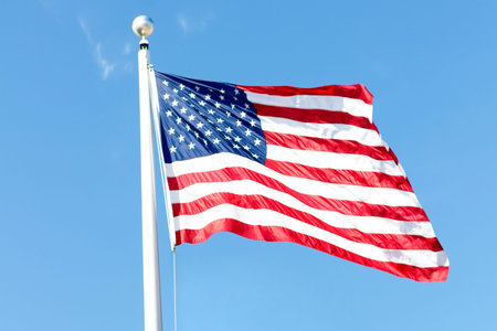 American flag on the blue sky. symbol of independence