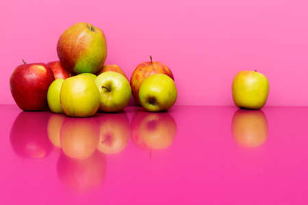 Ripe apples on the pink or magenta background. Concept of healthy foodの写真素材