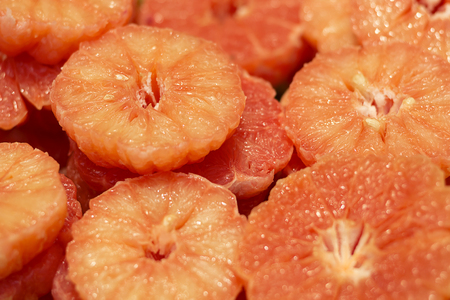 Pile of fresh grapefruits on display at street market.の写真素材