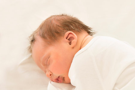 Adorable newborn baby sleeping. Few days boy sleep