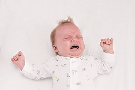 Newborm baby screaming just after born. Infant boy cryingの写真素材