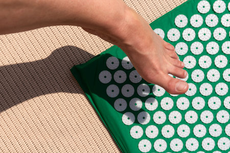 Massage mat for acupuncture, swimming pool flip-flops and foot. Green and blue color. Massage at...