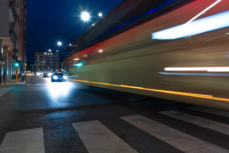 Timelapse view of traffic at an urban night intersection. Urban movement in the Italian city in the...
