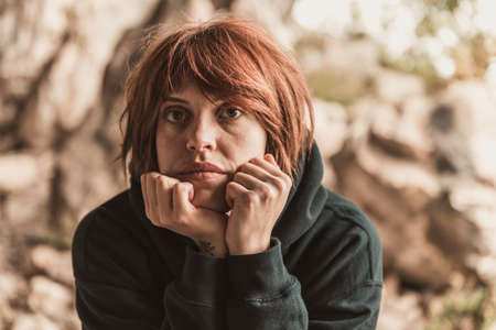 Portrait of a beautiful happy girl with red hair in the cave, lifestyleの写真素材