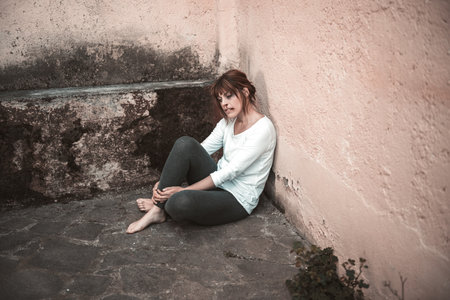 desperate  wounded girl with a look of sadの写真素材
