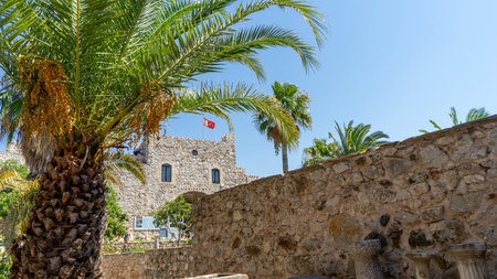 Marmaris Castle and Archeology Museum, huge historic landmark in Marmaris, Turkey. Turkish flag.の写真素材