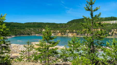Abandoned Lipovsky nickel quarry near city Rezh, Sverdlovsk region, the Urals with turquoise water...