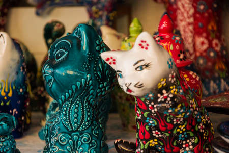 Handmade ceramic cat figurines. Souvenirs for sale.の写真素材