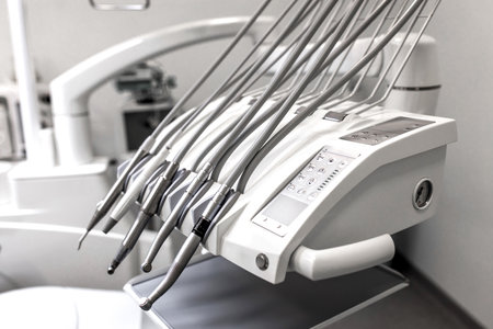 Close-up of the dental unit. Modern dental unit, instruments and devices for teeth treatment in the dentist's office in close-up. Various tips, ultrasonic scaler, surgical, endo and periodontal tips.の写真素材