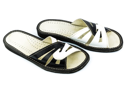 Handmade black-and-white leather shoes isolated on white backgroundの写真素材