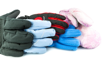 Multicolored ski gloves varied in size isolated on white backgroundの写真素材