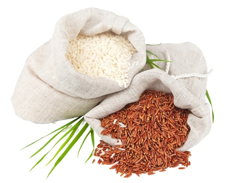 Macro view of sacks of white and red rice with greens isolated on white backgroundの写真素材