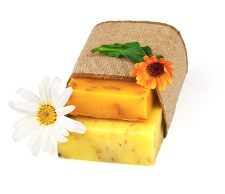 Macro view of handmade soap in sack with flowers isolated on white backgroundの写真素材
