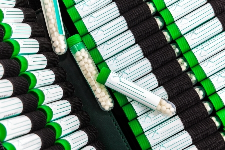 Open first aid kit with different homeopathic preparation insideの写真素材