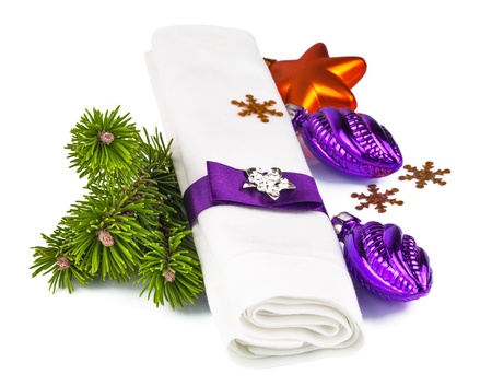 White napkin with Christmas decoration and twig Christmas tree isolated on white backgroundの写真素材