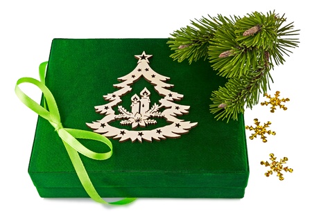 New Year green box with bow and twig Christmas tree isolated on white backgroundの写真素材