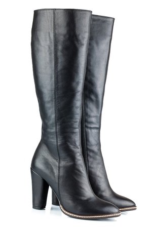 Black leather lady boots isolated on white backgroundの写真素材