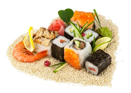 Sushi on sesame of heart shape with green leaf of heart shape isolated on white backgroundの写真素材
