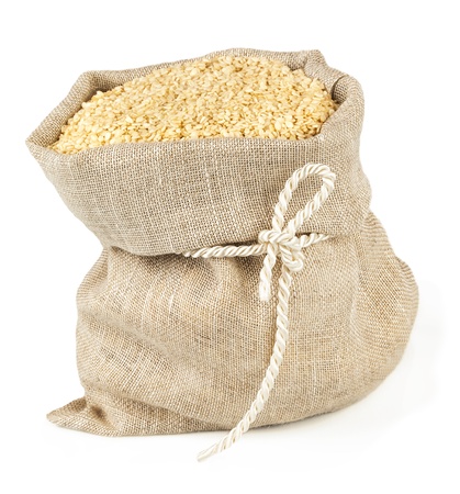 Macro view of sesame seeds in flax sack with tie isolated on white backgroundの写真素材