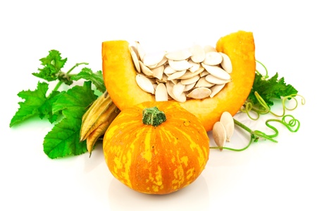 Pumpkin with pumpkin seeds isolated on white backgroundの写真素材