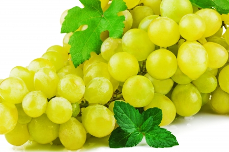 Part of bunch of grapes with green leaf isolated on white の写真素材