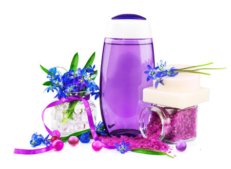 Spring concept with white soap, violet sea salt and purple snowdrops isolated on white backgroundの写真素材