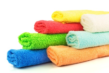 Macro view of several colorful towels on whiteの写真素材