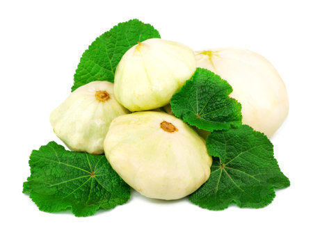 Macro view of fresh marrow with green leaves isolated on white backgroundの写真素材