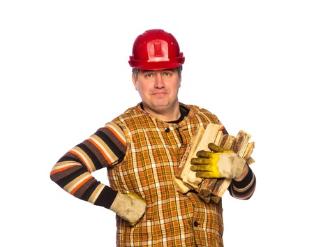 Portrait of adult carpenter in helmet in studio isolated on white backgroundの写真素材