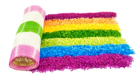 Macro view of bright rainbow of sea salt and towel isolated on white backgroundの写真素材