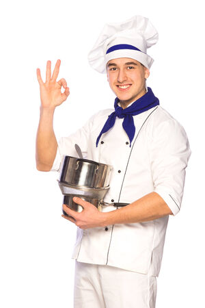 Portrait of smiling cook chef with kitchenware isolated on white backgroundの写真素材