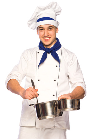 Portrait of smiling cook chef with kitchenware isolated on white backgroundの写真素材